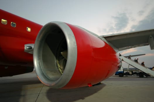 Red plane in an airport