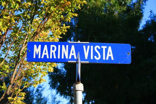 Street sign close up over blue sky.