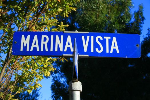 Street sign close up over blue sky.