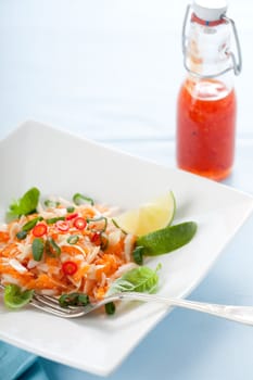 Vietnamese carrot salad with chili sauce and lime