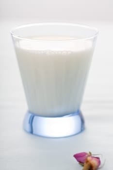 Small blue glass with fresh milk