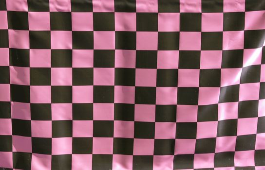 Checked fabric background with black and pink colours