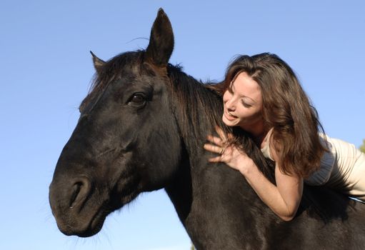 young woman and her best friend black stallion