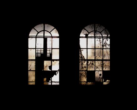 Old industrial windows in abandoned factory