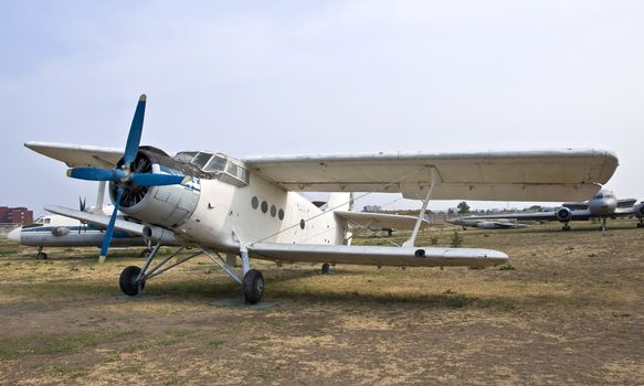 Light passenger plane aircraft. Biplane is on the ground.