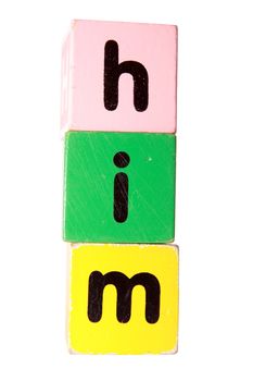 assorted childrens toy letter building blocks against a white background that spell him with clipping path