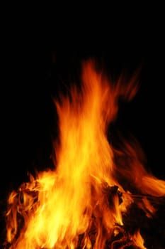 Fiery hot flame blazing with dark background