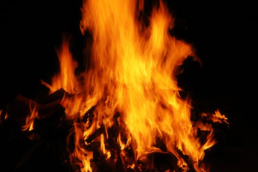 Fiery hot flame blazing with dark background