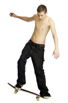 Teenager riding a skateboard with no shirt isolated on white background.