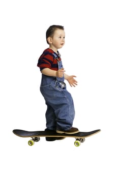 Born to be wild and just two years ago. A two year old playing with his older brothers skateboard.