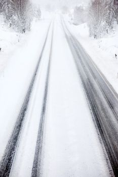 A car travelling in a snow storm