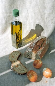 Pasch eggs, bread and small bottle of olive oil 