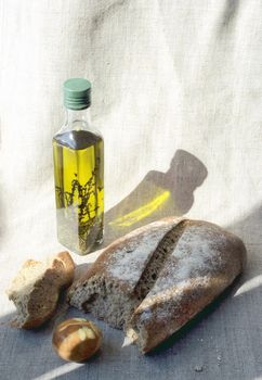 Easter bread, small bottle of olive oil and pasch egg