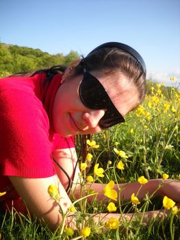 The girl, happiness, a smile, a grass, the person, day, the woman, flower; a plant; spring; flowering; a wood       