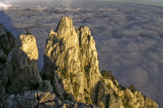 Sunset rocks and sea of clouds