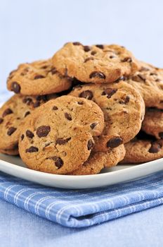 Plate with big pile of chocolate chip cookies