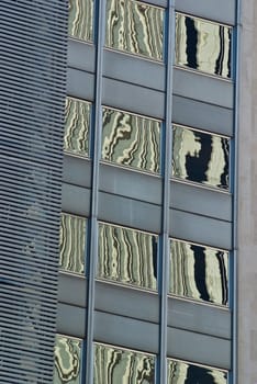 Reflections in the facade of a modern building, taken in Madrid, Spain.