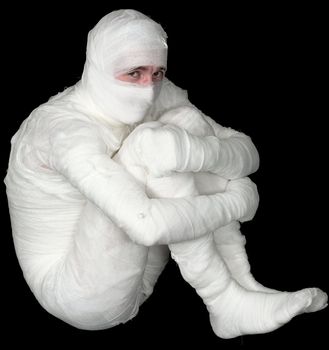 Egyptian mummy emo sitting on the black background