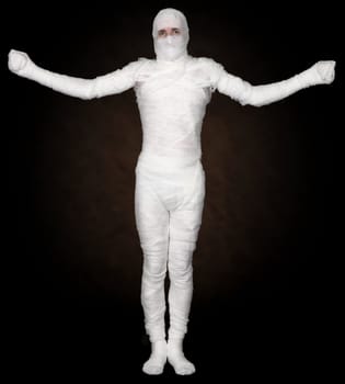 Man in bandage on the black background