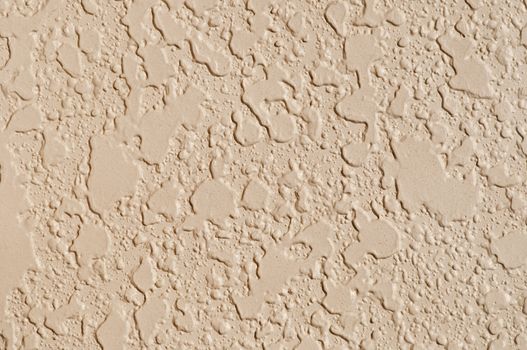 Textured wall with an earthtone color paint 