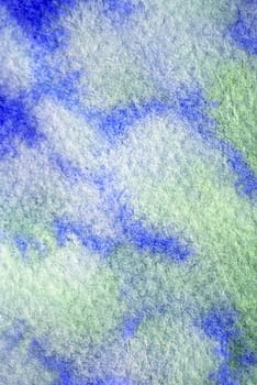 Green and blue paint on watercolor paper with texture for backgrounds.