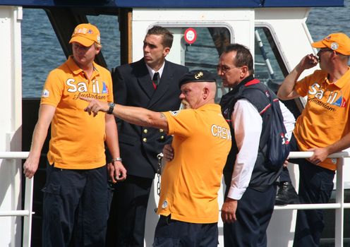 AMSTERDAM, AUGUST 19, 2010: Organization crew members at Sail 2010 in Amsterdam, Holland on august 19, 2010