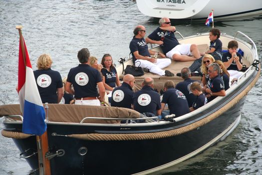 AMSTERDAM, AUGUST 19, 2010: Organization crew in a sloop at Sail 2010 in Amsterdam, Holland on august 19, 2010