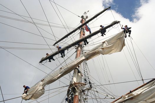 Sailors in the mast of Dutch tall ship Stad Amsterdam at Sail 2010 in Amsterdam