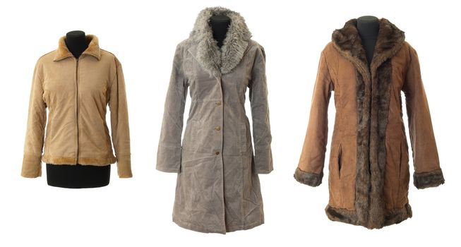 Three winter female fur coats. Isolated on white background