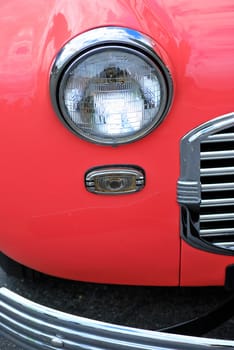 Classic vintage car on display outdoors.