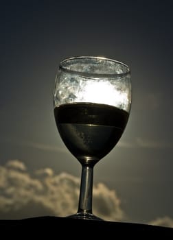 A glass of white house wine, taken at sunset on Madeira, Portugal.