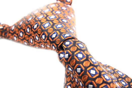 Orange tie knot isolated on white background