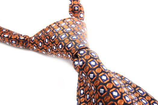 Orange tie knot isolated on white background