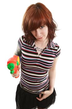 Photo of a beautiful redhead about to shoot a water gun.