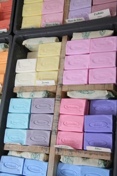 Colorful bars of soap, a local product of the Provence. Displayed in boxes on a market in B�doin