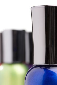 Bottle with blue nail polish and a black cap.