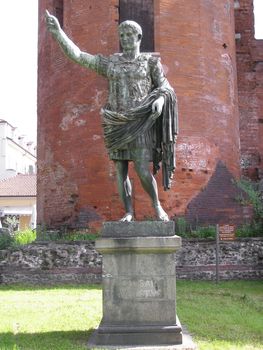 Roman statue of Caesar Augustus in front of roman walls