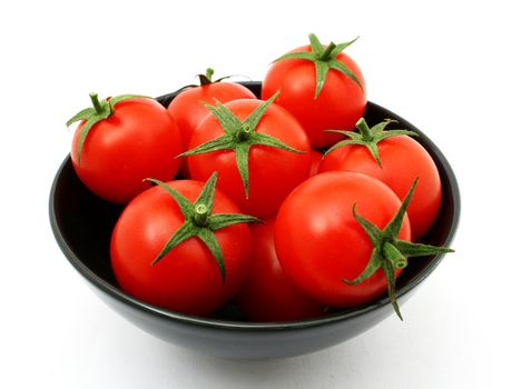 tomatoes in a black bowl