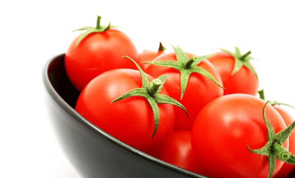 tomatoes in a black bowl