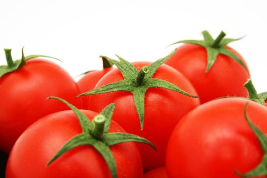 many tomatoes isolated on white