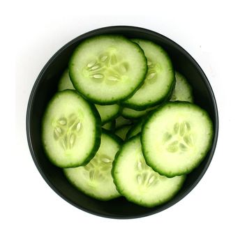 cucumber slices in a black bowl