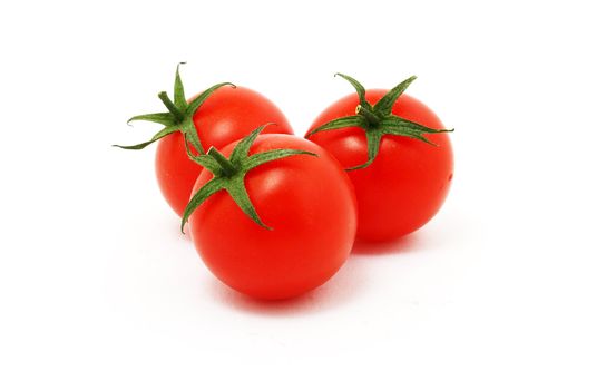 three tomatoes isolated on white