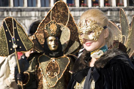 Traditionally dressed Venice carnival  female performer in Piazza San Marco, Italy