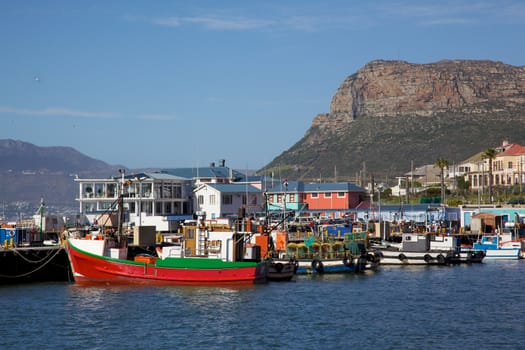 Fishing boats moored in Kalk Bay Harbour, Cape Peninsula, South Africa.