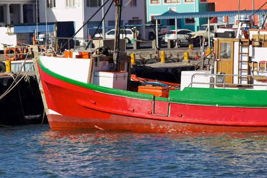 A fishing boat moored in Kalk Bay Harbour, Cape Peninsula, South Africa.