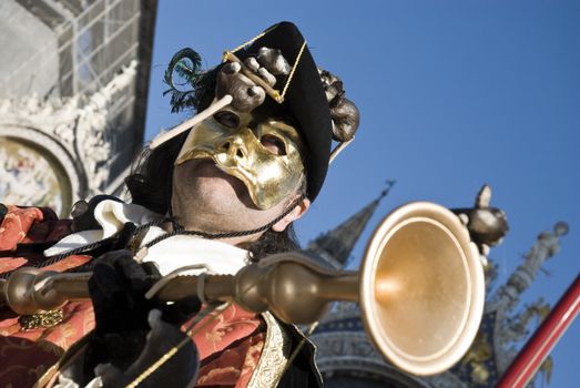 Traditionally dressed Venice carnival  male performer in Piazza San Marco, Italy