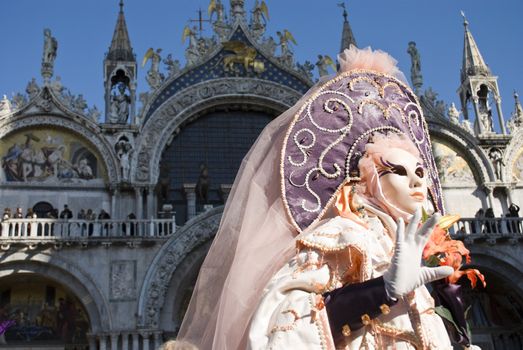 Traditionally dressed Venice carnival  female performer in Piazza San Marco, Italy
