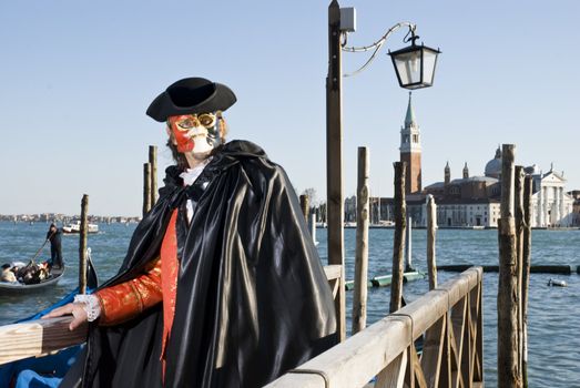 Traditionally dressed Venice carnival  male performer in Piazza San Marco, Italy