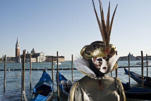 Traditionally dressed Venice carnival  female performer in Piazza San Marco, Italy