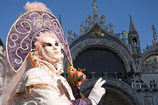 Traditionally dressed Venice carnival  female performer in Piazza San Marco, Italy